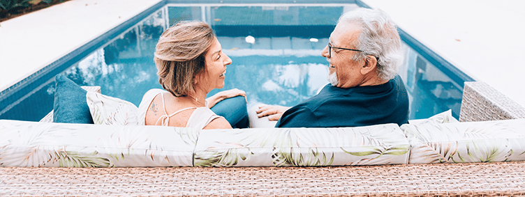 happy-couple-enjoying-beautiful-backyard-with-pool