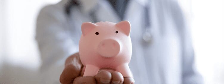 healthcare-professional-holding-piggy-bank-in-hand