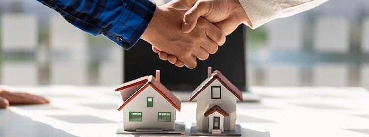 mortgage-lender-and-customer-shaking-hands-at-closing