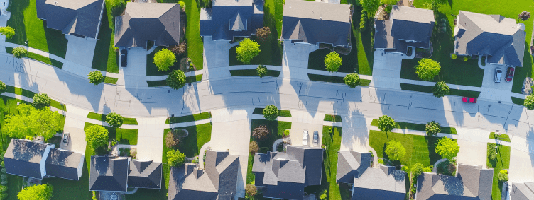 neighborhood street with row of houses