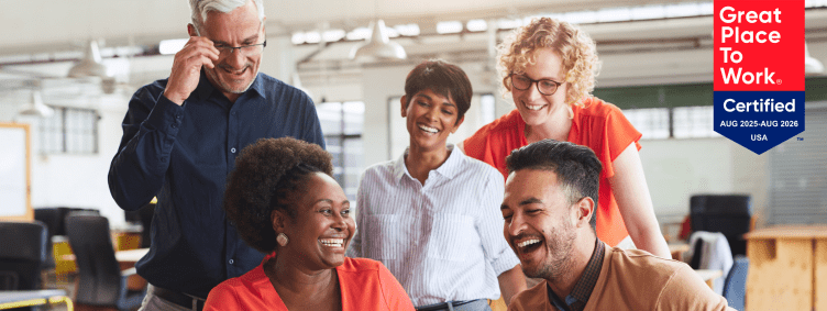 diverse employees celebrating success and teamwork in the office