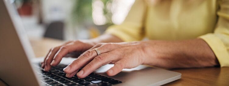 senior-typing-on-laptop